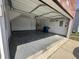 Open garage view showcasing the spacious interior, water heater, and potential for parking at 1404 Alonzo Pl, Indianapolis, IN 46217