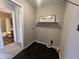 Combined laundry and bathroom area, offering convenience at 1404 Alonzo Pl, Indianapolis, IN 46217