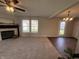Living room with carpet, fireplace, and view of the dining room and entrance at 1404 Alonzo Pl, Indianapolis, IN 46217