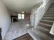 Bright, carpeted living room with a fireplace and staircase at 1404 Alonzo Pl, Indianapolis, IN 46217