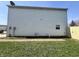 Home's exterior side showing a gated yard and access point at 1404 Alonzo Pl, Indianapolis, IN 46217