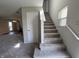 Carpeted stairway with a window that brings natural light to the stairs at 1404 Alonzo Pl, Indianapolis, IN 46217
