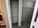 Bright walk-in closet includes built-in shelving and an organized layout for optimal storage at 1404 Alonzo Pl, Indianapolis, IN 46217