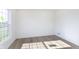 This bedroom features hardwood floors and natural light from a large window at 14532 Hanford Ln, Carmel, IN 46074