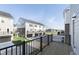 Beautiful townhouse with black garage doors and a wooden deck, overlooking the green lawn at 14532 Hanford Ln, Carmel, IN 46074