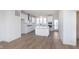 Modern kitchen with stainless steel appliances, center island, and bright white cabinets at 14532 Hanford Ln, Carmel, IN 46074