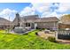 Spacious backyard featuring a patio with outdoor seating and a fire pit area for outdoor gatherings at 1598 Thornburg Ln, Franklin, IN 46131