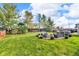 Well-maintained backyard featuring a fire pit and outdoor seating, ideal for enjoying outdoor living at 1598 Thornburg Ln, Franklin, IN 46131