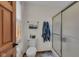 Bright bathroom with a toilet, walk-in shower, and wood trim at 1598 Thornburg Ln, Franklin, IN 46131