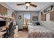 This bedroom features a twin bed, a desk, and ample storage with charming built-in wall units at 1598 Thornburg Ln, Franklin, IN 46131