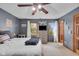 Comfortable bedroom featuring a queen-sized bed, ceiling fan and ample natural light at 1598 Thornburg Ln, Franklin, IN 46131