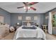 Comfortable bedroom featuring a queen-sized bed, ceiling fan and ample natural light at 1598 Thornburg Ln, Franklin, IN 46131