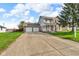 Charming brick and siding two-story home with a two-car garage and a spacious front yard at 1598 Thornburg Ln, Franklin, IN 46131