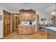 Functional kitchen with light countertops, abundant wooden cabinetry, and hardwood floors at 1598 Thornburg Ln, Franklin, IN 46131