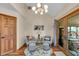 Intimate sitting area features a round rug, hardwood floors, and modern decor at 1598 Thornburg Ln, Franklin, IN 46131