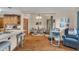 Inviting sitting area features hardwood floors, modern decor and adjoins the kitchen at 1598 Thornburg Ln, Franklin, IN 46131