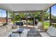 Bright sunroom with plush seating, providing a relaxing view of the backyard patio and outdoor furniture at 1598 Thornburg Ln, Franklin, IN 46131