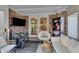 Comfortable sunroom featuring brick walls, a cozy seating area, and a TV for relaxation and entertainment at 1598 Thornburg Ln, Franklin, IN 46131