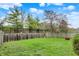 Well-maintained backyard featuring green lawn with a wooden fence that provides privacy at 16838 Aulton Dr, Noblesville, IN 46060