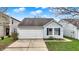 Charming single-Gathering home with a white garage door, blue shutters, and landscaped front yard at 16838 Aulton Dr, Noblesville, IN 46060