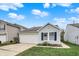 Attractive single-Gathering home with a white garage door, blue shutters, and landscaped front yard at 16838 Aulton Dr, Noblesville, IN 46060