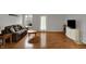 Spacious living room featuring laminate flooring, a comfortable couch, and ample natural light at 16838 Aulton Dr, Noblesville, IN 46060