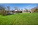 Spacious backyard with a covered pool, lush lawn, and natural surroundings, perfect for outdoor enjoyment at 1791 S Conservation Club Rd, Morgantown, IN 46160
