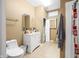Full bathroom with single vanity, medicine cabinet, toilet, and tile floors at 1791 S Conservation Club Rd, Morgantown, IN 46160