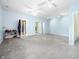 Expansive bedroom with walk-in closets, carpet, neutral paint, and ceiling fans at 1791 S Conservation Club Rd, Morgantown, IN 46160