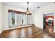 Bright dining room with hardwood floors, a chandelier, and large windows at 1791 S Conservation Club Rd, Morgantown, IN 46160