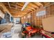 Spacious garage featuring unfinished walls, a riding lawn mower and ample space for storage at 1791 S Conservation Club Rd, Morgantown, IN 46160