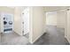 Hallway showing access to a laundry room and bathroom at 1791 S Conservation Club Rd, Morgantown, IN 46160