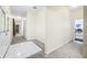 Hallway leading to laundry room with white tile accent at 1791 S Conservation Club Rd, Morgantown, IN 46160