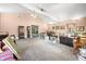 Large living area with neutral carpet, vaulted ceilings, and natural light at 1791 S Conservation Club Rd, Morgantown, IN 46160