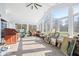 Bright sunroom features high ceilings, large windows, and tile floors at 1791 S Conservation Club Rd, Morgantown, IN 46160