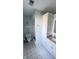 Bathroom showcasing white cabinets, modern shower, and stylish wallpaper at 1813 Birch Dr, Plainfield, IN 46168