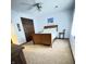 Bedroom showcasing carpeted floors, a ceiling fan, and a wooden bed frame at 1813 Birch Dr, Plainfield, IN 46168