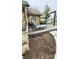 Relaxing deck with lounge chairs and an outdoor swing, ideal for enjoying the beautiful landscape at 1813 Birch Dr, Plainfield, IN 46168