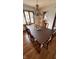 Open dining room showcasing wood floors, chandelier, and window that provides natural light at 1813 Birch Dr, Plainfield, IN 46168