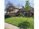 Well-maintained home with lush green lawn and mature trees at 1813 Birch Dr, Plainfield, IN 46168
