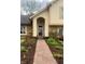 Inviting front entrance with a brick pathway and manicured garden at 1813 Birch Dr, Plainfield, IN 46168