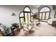 Sunroom with arched windows and comfortable seating, creating a peaceful atmosphere at 1813 Birch Dr, Plainfield, IN 46168