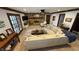 Open living room featuring a stone fireplace, ceiling fan, and ample seating at 1813 Birch Dr, Plainfield, IN 46168