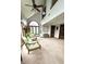 Open living room showcasing the vaulted ceilings, arched windows, natural light, and cozy seating at 1813 Birch Dr, Plainfield, IN 46168