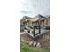Outdoor patio with stone accents, a swing, and seating for entertaining at 1813 Birch Dr, Plainfield, IN 46168