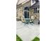 Outdoor patio with stone facade featuring table, chairs, and arched opening for relaxing at 1813 Birch Dr, Plainfield, IN 46168