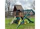 A playground with swings, a slide, and climbing equipment provides fun for  at 1813 Birch Dr, Plainfield, IN 46168