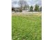 A fenced community pool and grassy areas provide a recreational space for residents at 1813 Birch Dr, Plainfield, IN 46168