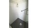 The sleek white shower features modern subway tile and a glass door at 1813 Birch Dr, Plainfield, IN 46168