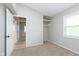 This bedroom features a neutral color scheme, soft carpet, and a closet space at 1946 N Riley Ave, Indianapolis, IN 46218